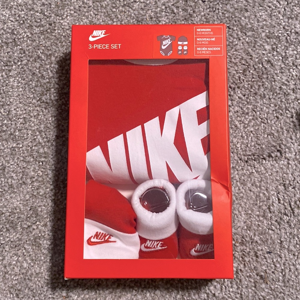 Newborn Nike 3-piece set red includes socks Nike logo, hat, and onesie